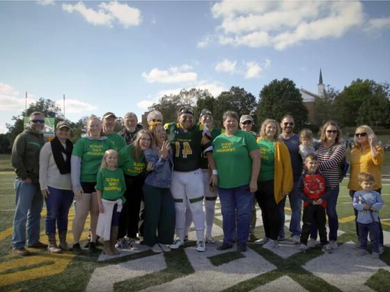 Students and family on the football field